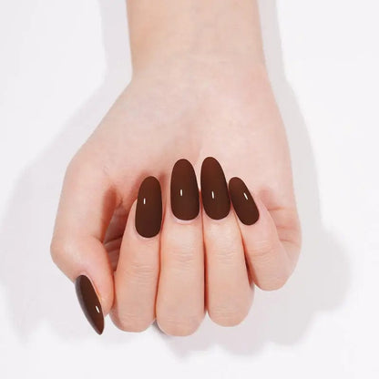 Cupped hands displaying chocolate brown gel nails with glossy finish for at-home manicure