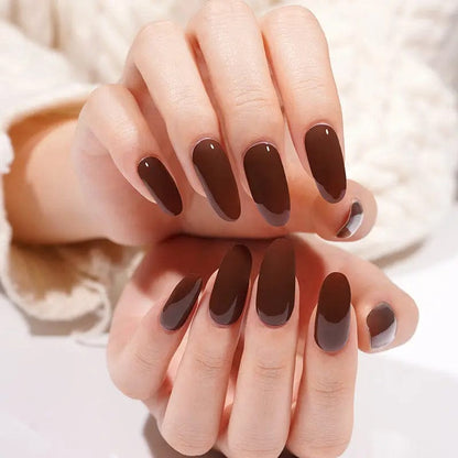 Rich chocolate brown gel nail wraps on hands creating elegant glossy manicure
