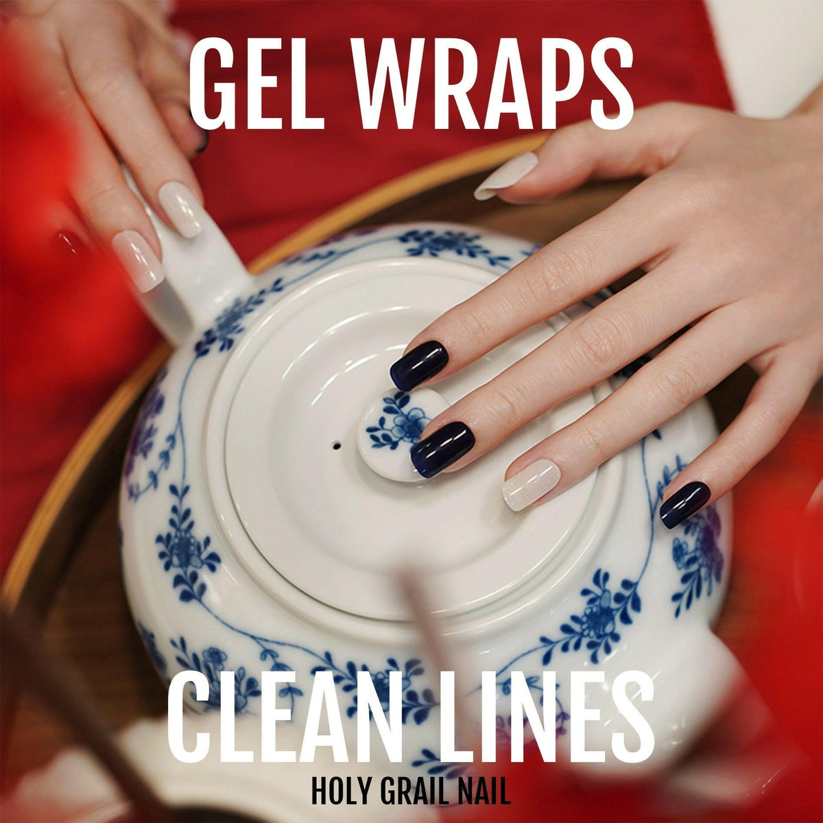 Navy blue and white gel nail wraps on hand creating clean minimalist manicure design