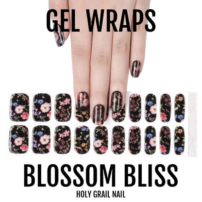 Black gel nail wraps with pink floral pattern on hand showing gothic botanical nail art