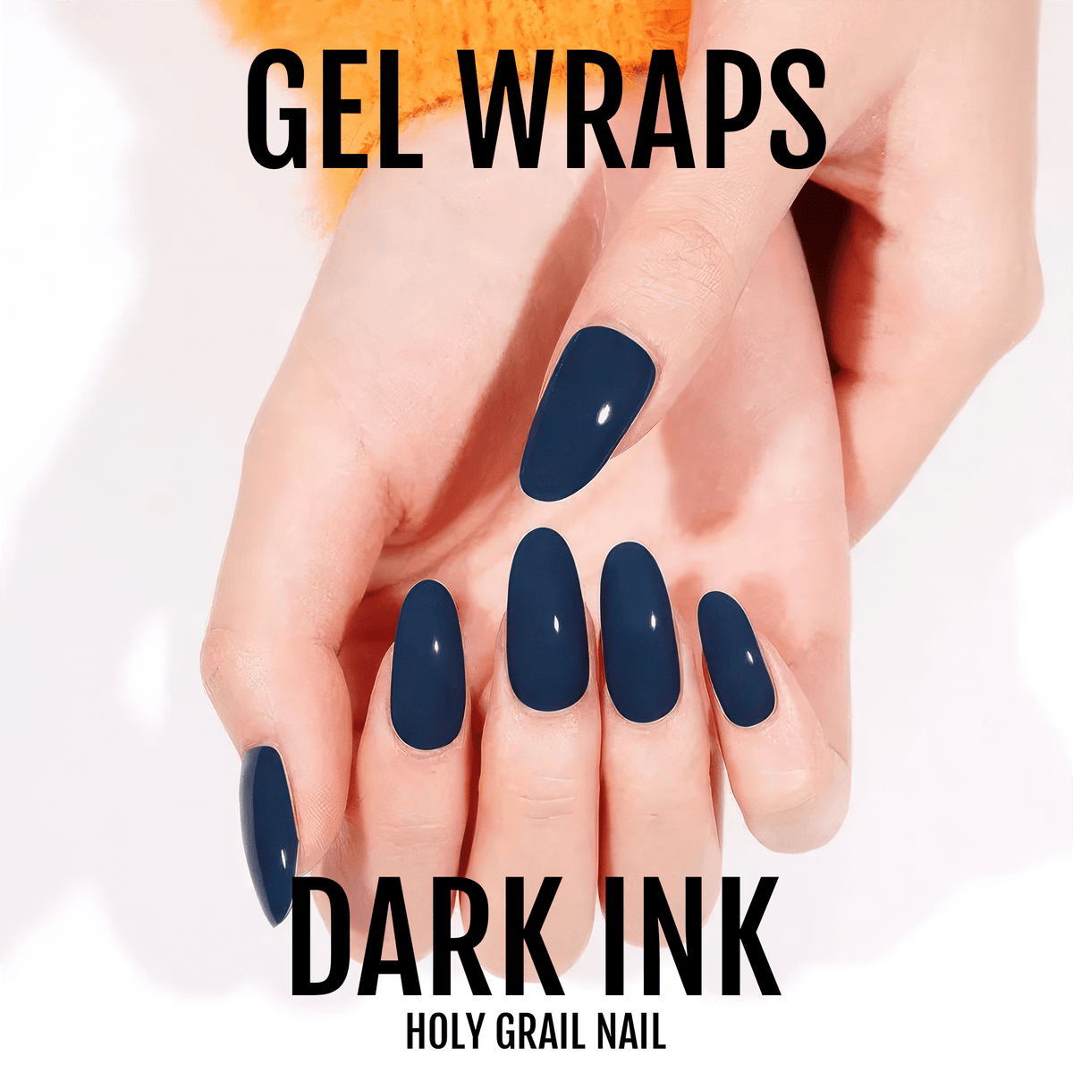 Hand showing dark navy gel nail wraps in glossy finish for at-home manicure