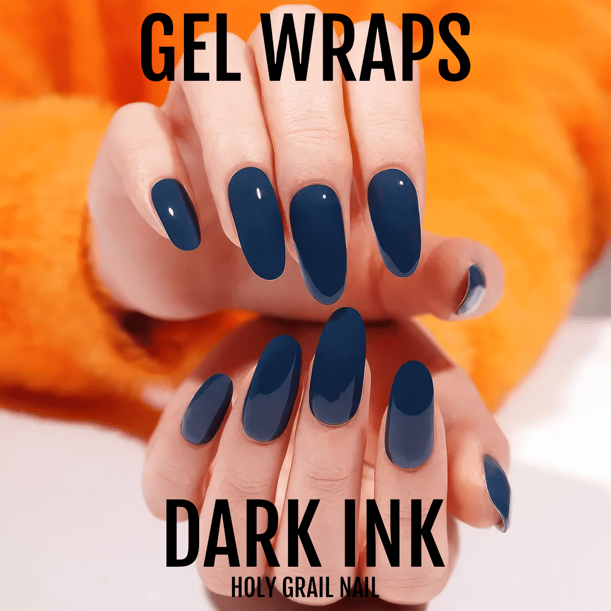 Two hands displaying dark ink blue gel nail wraps with glossy finish