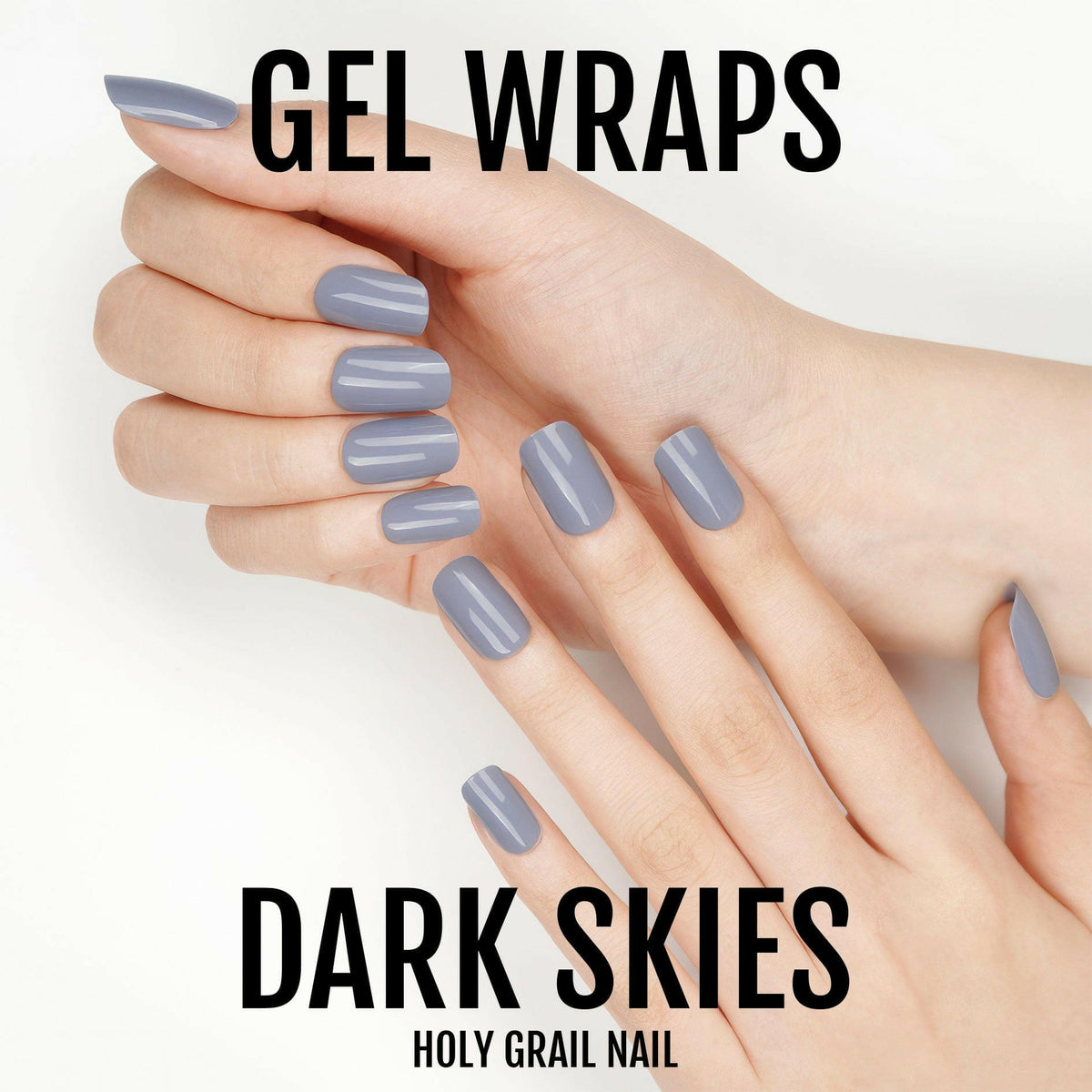 Hands displaying dark grey gel nail wraps with glossy finish for at-home manicure