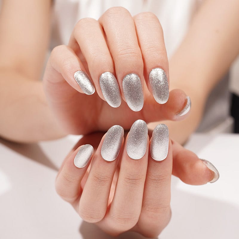 Silver glitter gel nail wraps on hands showing sparkly chrome finish for at-home manicure