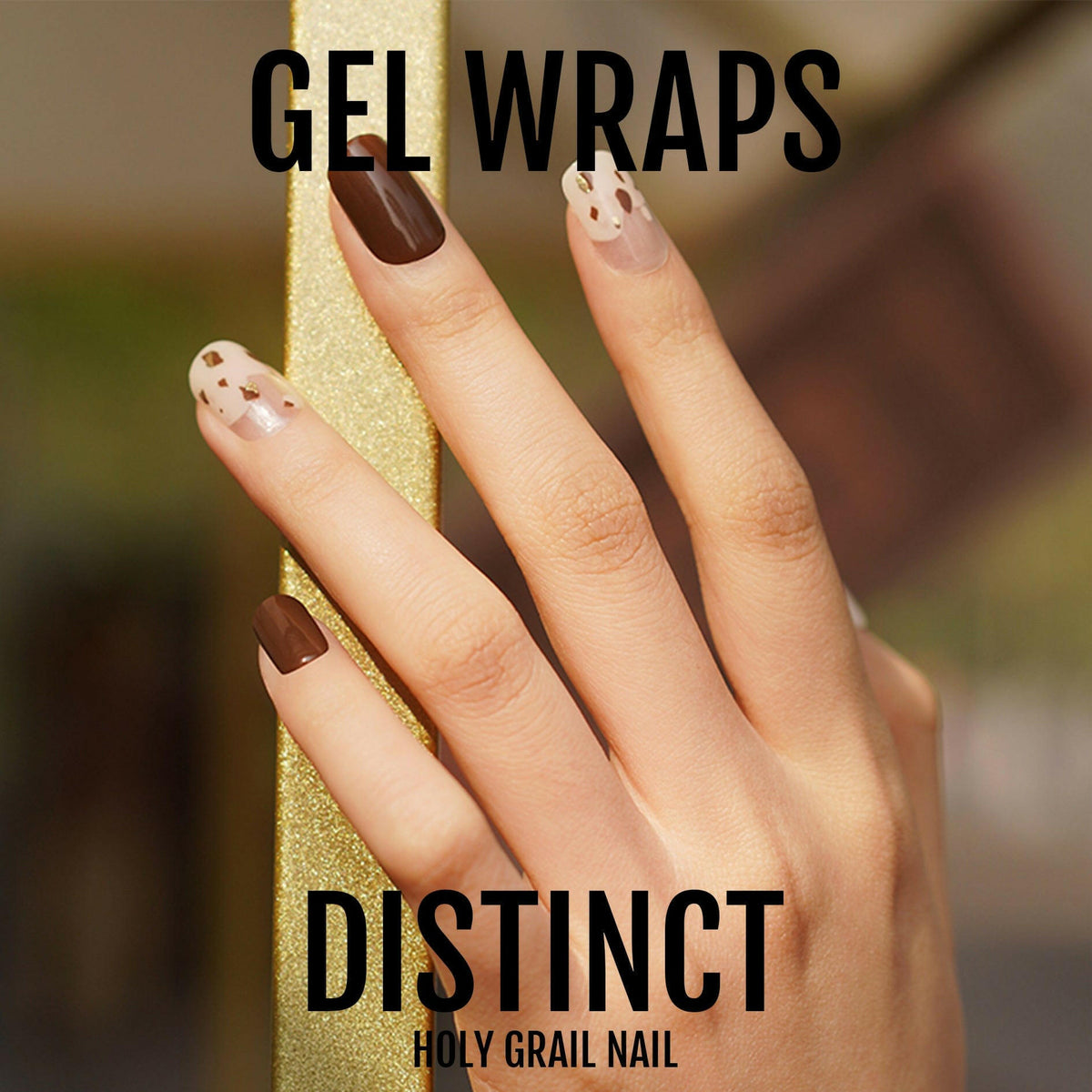 Distinct gel nail wraps featuring brown chocolate and nude polish with gold polka dot pattern