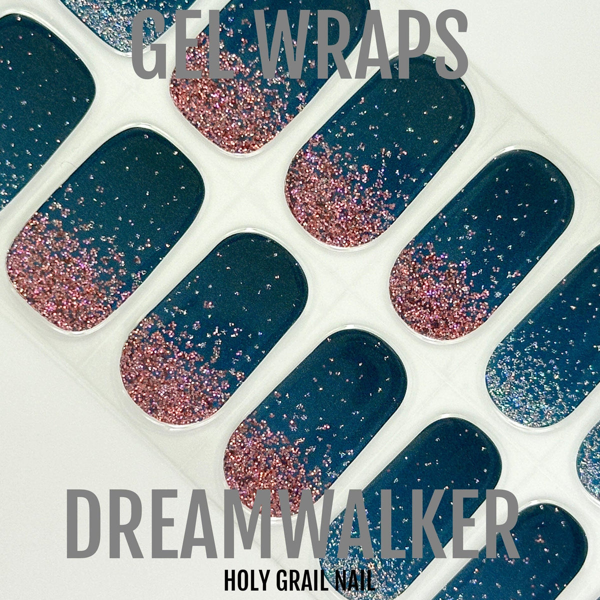 Dreamwalker gel nail wraps close-up showing navy blue and rose gold glitter gradient pattern