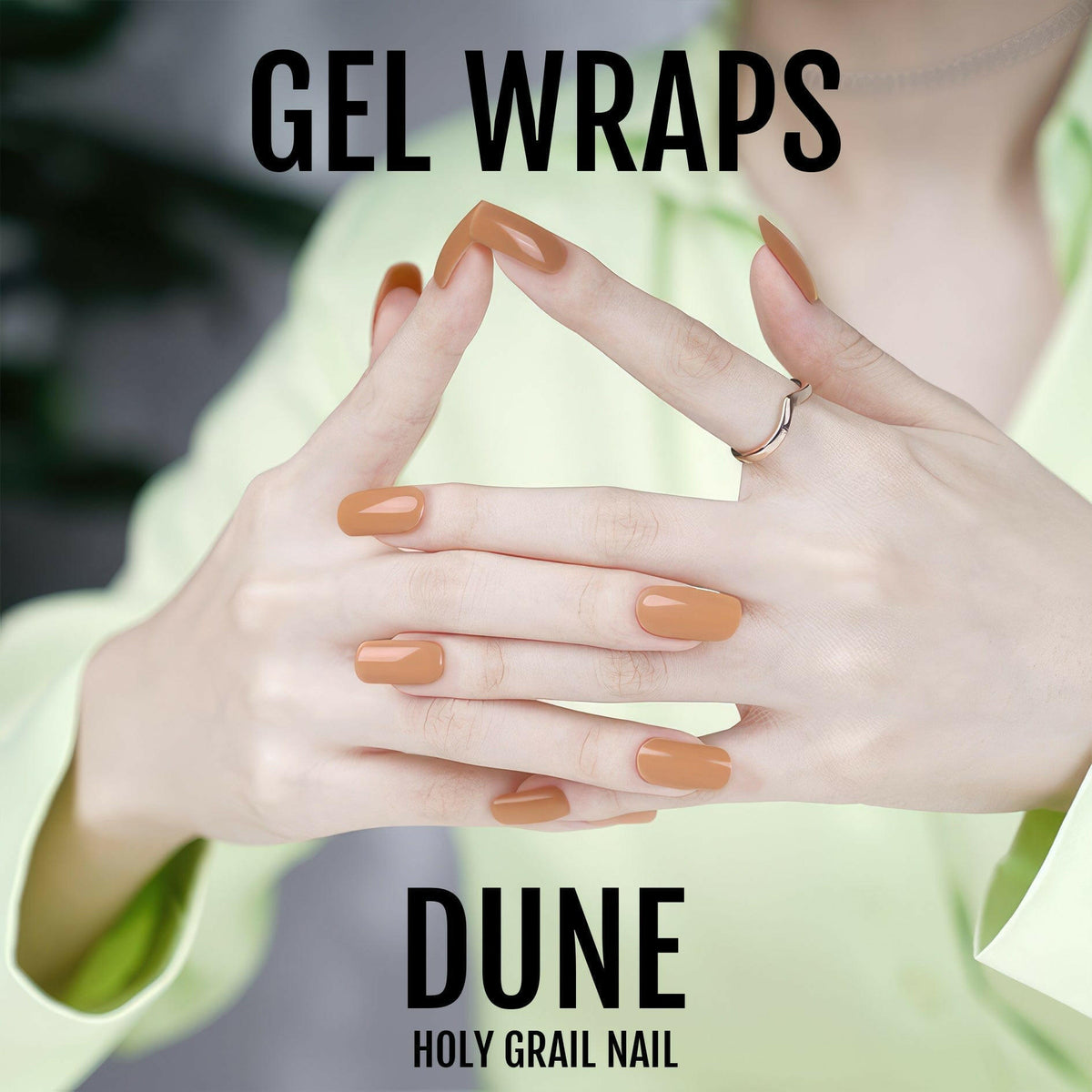 Dune gel nail wraps in warm caramel brown shade on hands creating natural manicure