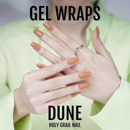 Caramel brown gel nail wraps displayed on crossed hands showing glossy autumn nail colour