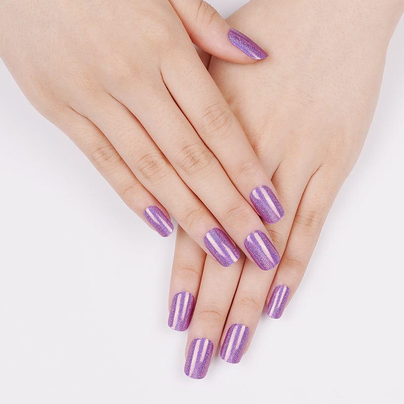 Purple metallic gel nail wraps on hands showing prismatic holographic nail art finish