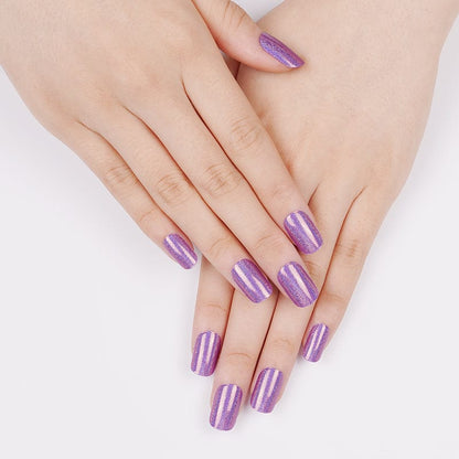 Purple metallic gel nail wraps on hands showing prismatic holographic nail art finish