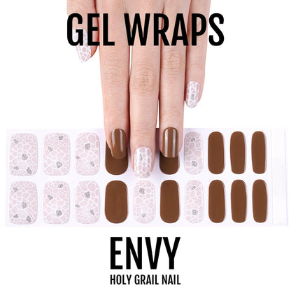 Brown chocolate gel nail wraps with white pearl pattern on hand manicure