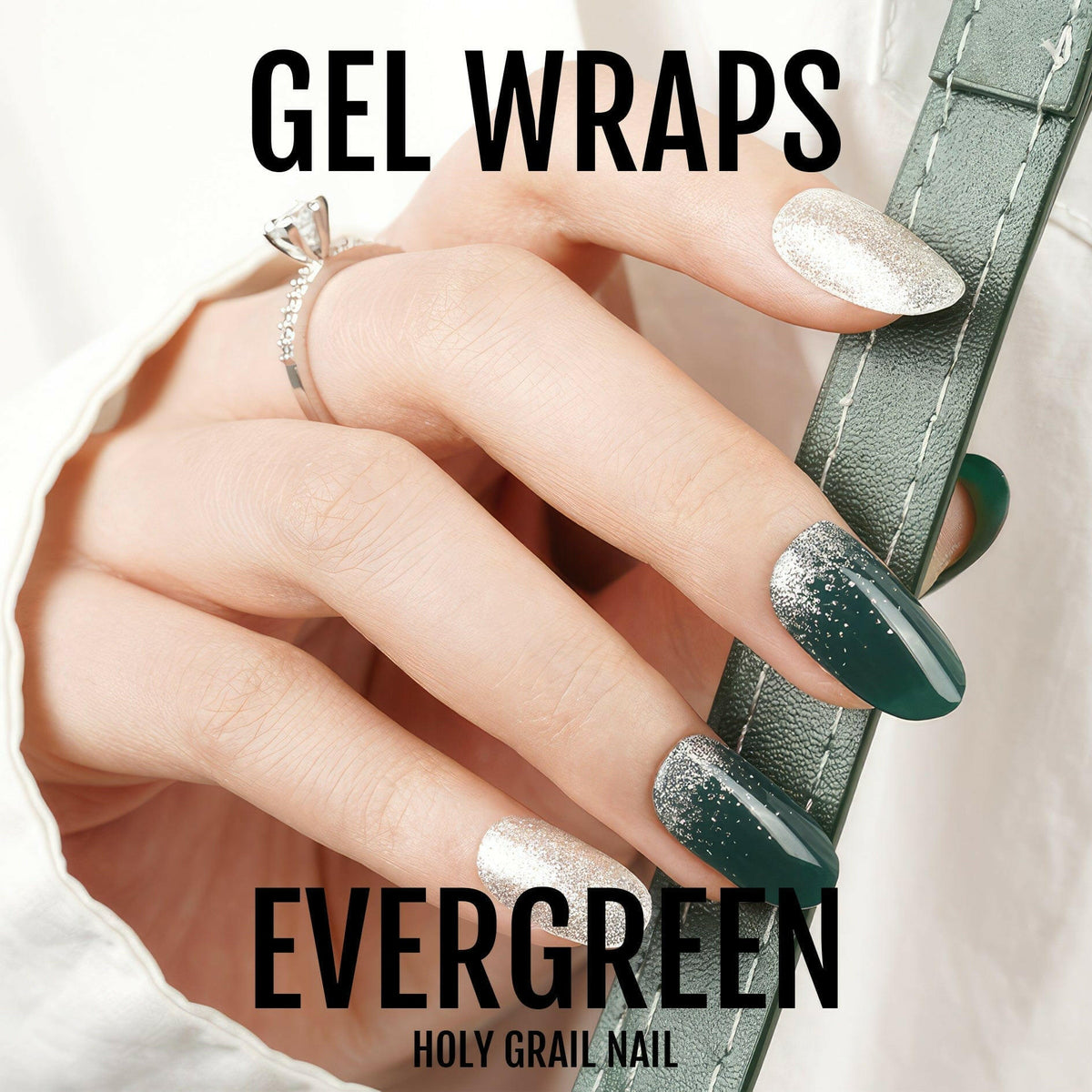 Hand wearing forest green glittery gel nail wraps with champagne accent nails
