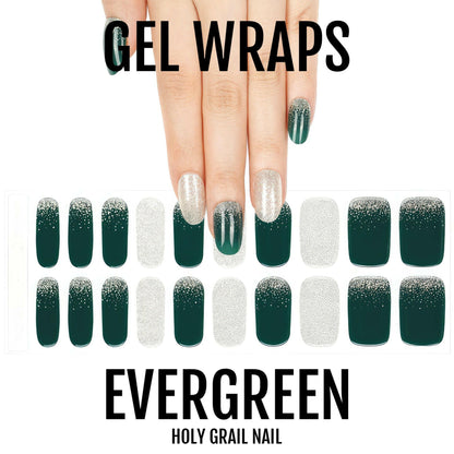 Hands displaying green glitter gel nail wraps with champagne French tip design