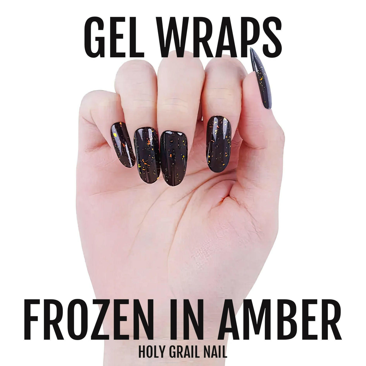 Hand wearing dark amber sparkle gel nail wraps with bronze metallic glitter finish manicure