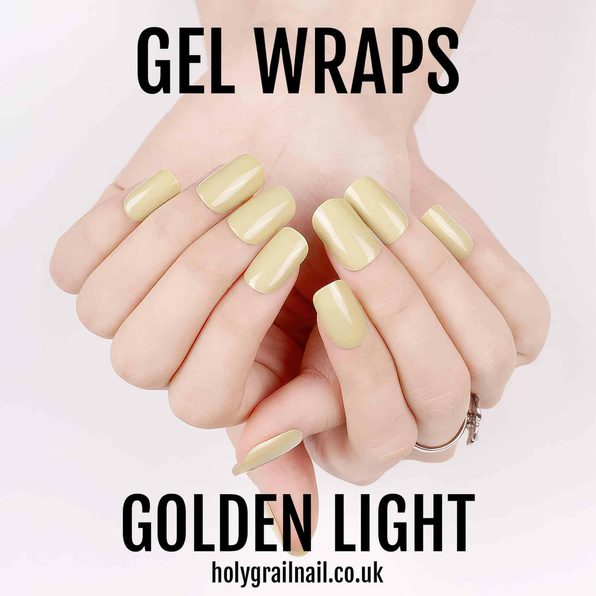 Golden light gel nail wraps on hands showing high shine metallic finish