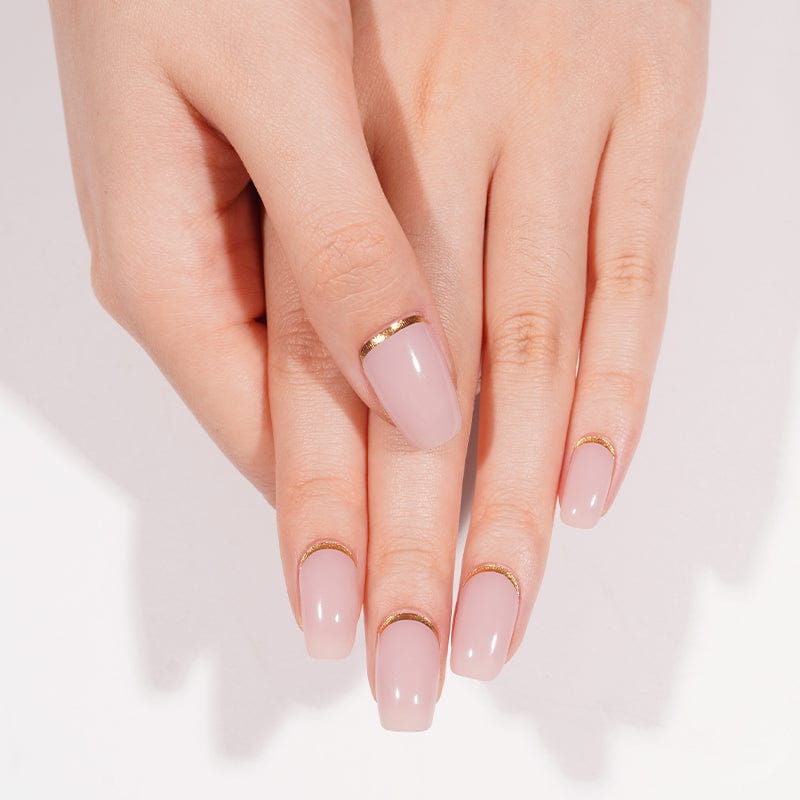 Close-up of hands with dusty rose gel nails featuring delicate shimmer effect