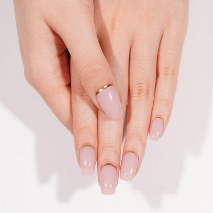 Close-up of hands with dusty rose gel nails featuring delicate shimmer effect