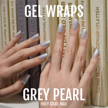 Grey pearl gel nail wraps on hands with sophisticated metallic shimmer finish