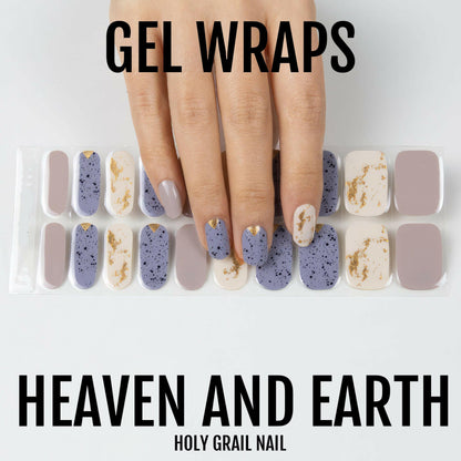 Gel nail wraps on hand featuring speckled blue and gold marble terrazzo pattern