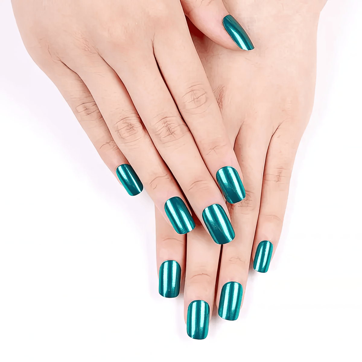 Two hands displaying jade green chrome gel nail wraps with high shine finish