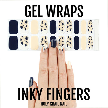 Semi-cured gel wraps featuring black cream and ink splatter nail art design