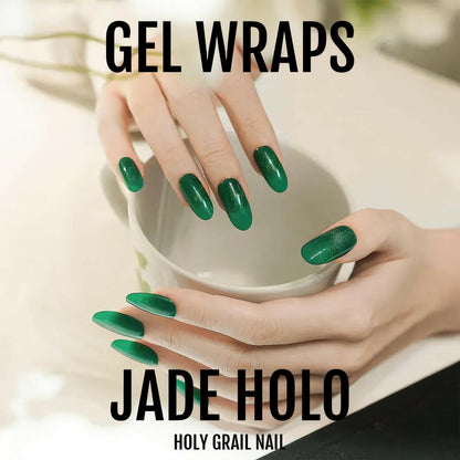Jade green holographic gel nail wraps on both hands holding white bowl