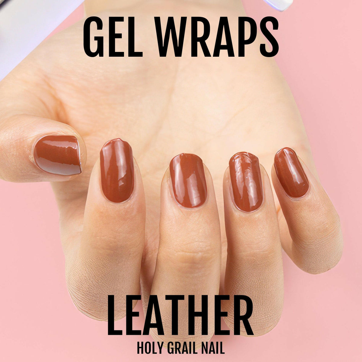 Glossy terracotta brown gel nail wraps on hand showing professional manicure finish