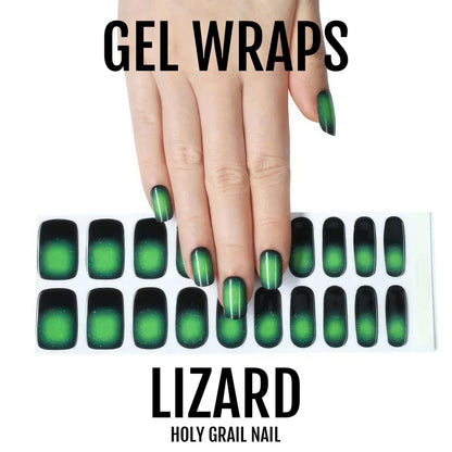 Hand showing green chrome gel nail wraps with black gradient ombre effect