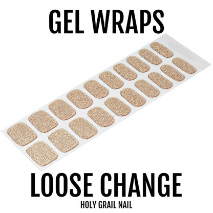 Sheet of champagne gold glitter gel nail wraps showing sparkly metallic finish nail art