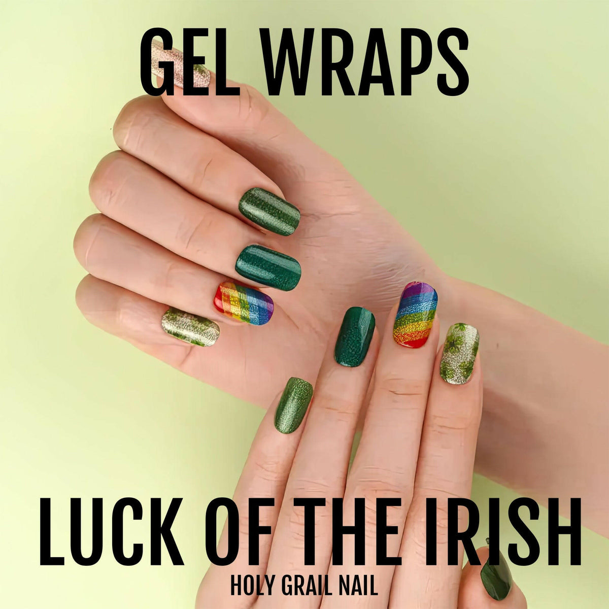 Hand displaying luck of the Irish gel nail wraps with shamrock and rainbow patterns