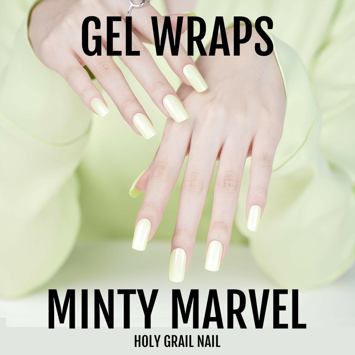 Pastel mint green gel nail wraps on manicured hand with soft sage finish