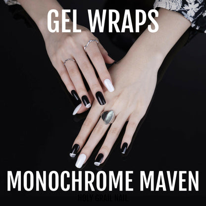 Black and white gel nail wraps on hands showing alternating monochrome design