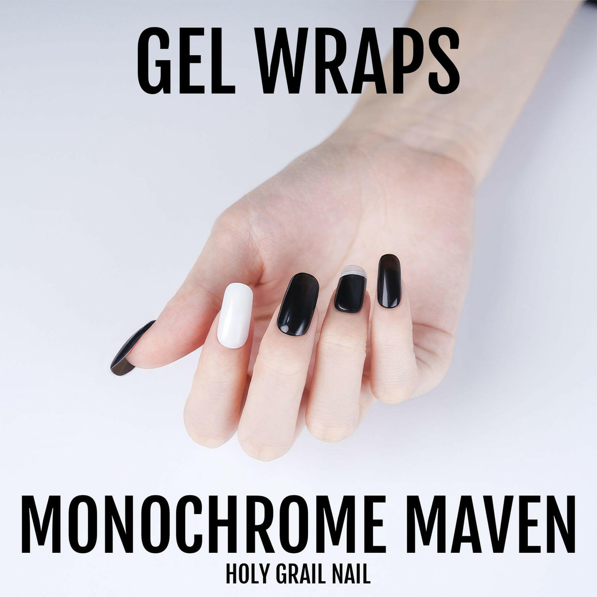 Black and white gel nail wraps on hand showing monochrome manicure design