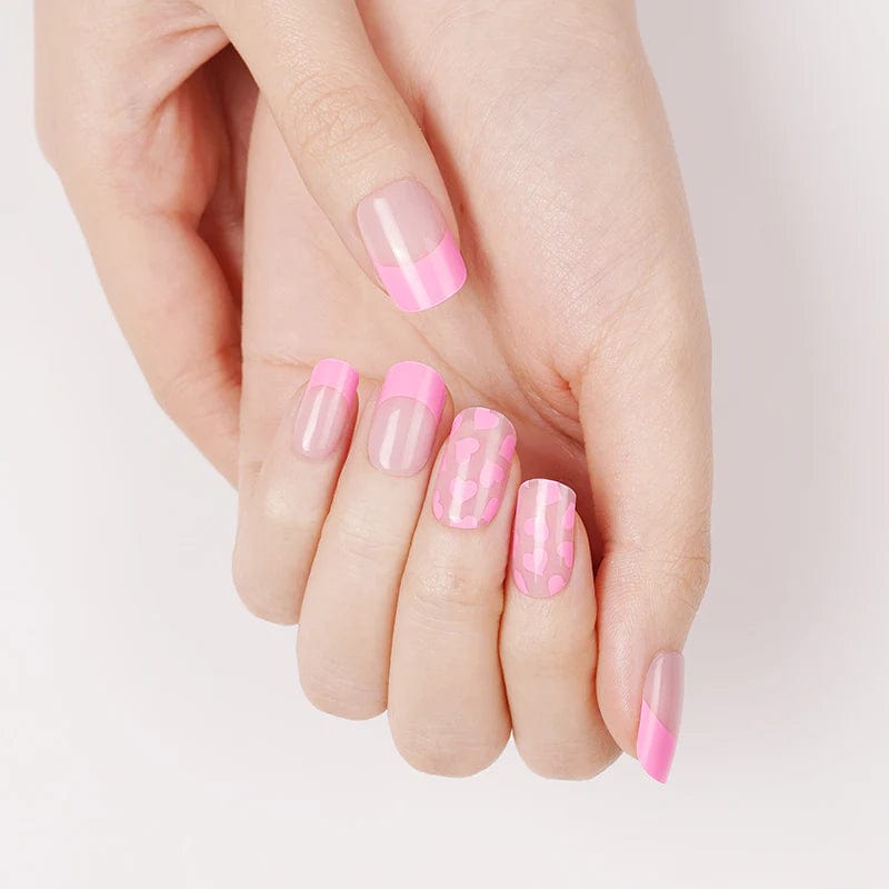 Pink French tip gel nail wraps on hand showing glossy finish