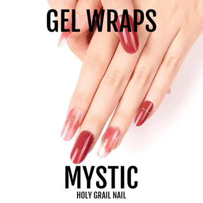 Hand showing red burgundy gel nail wraps with gold chain accent nail art design