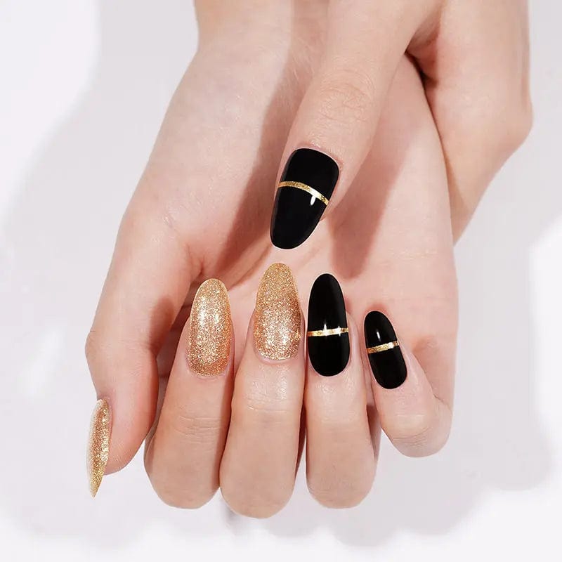 Sophisticated black gel nails with gold glitter accents showing elegant at-home manicure