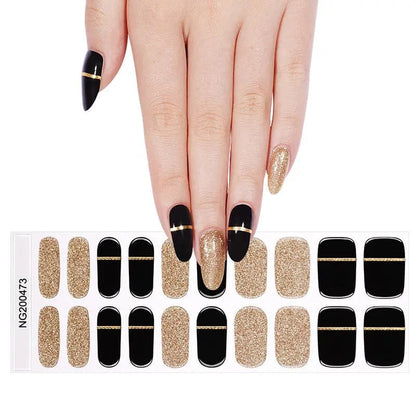 Semi-cured gel nail wrap sheet featuring black and gold glitter stripe design