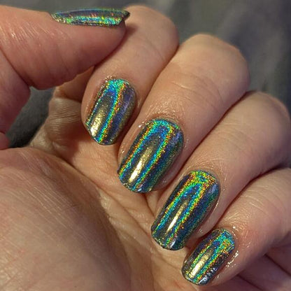 Rainbow chrome gel nail wraps showing prismatic holographic finish on hand