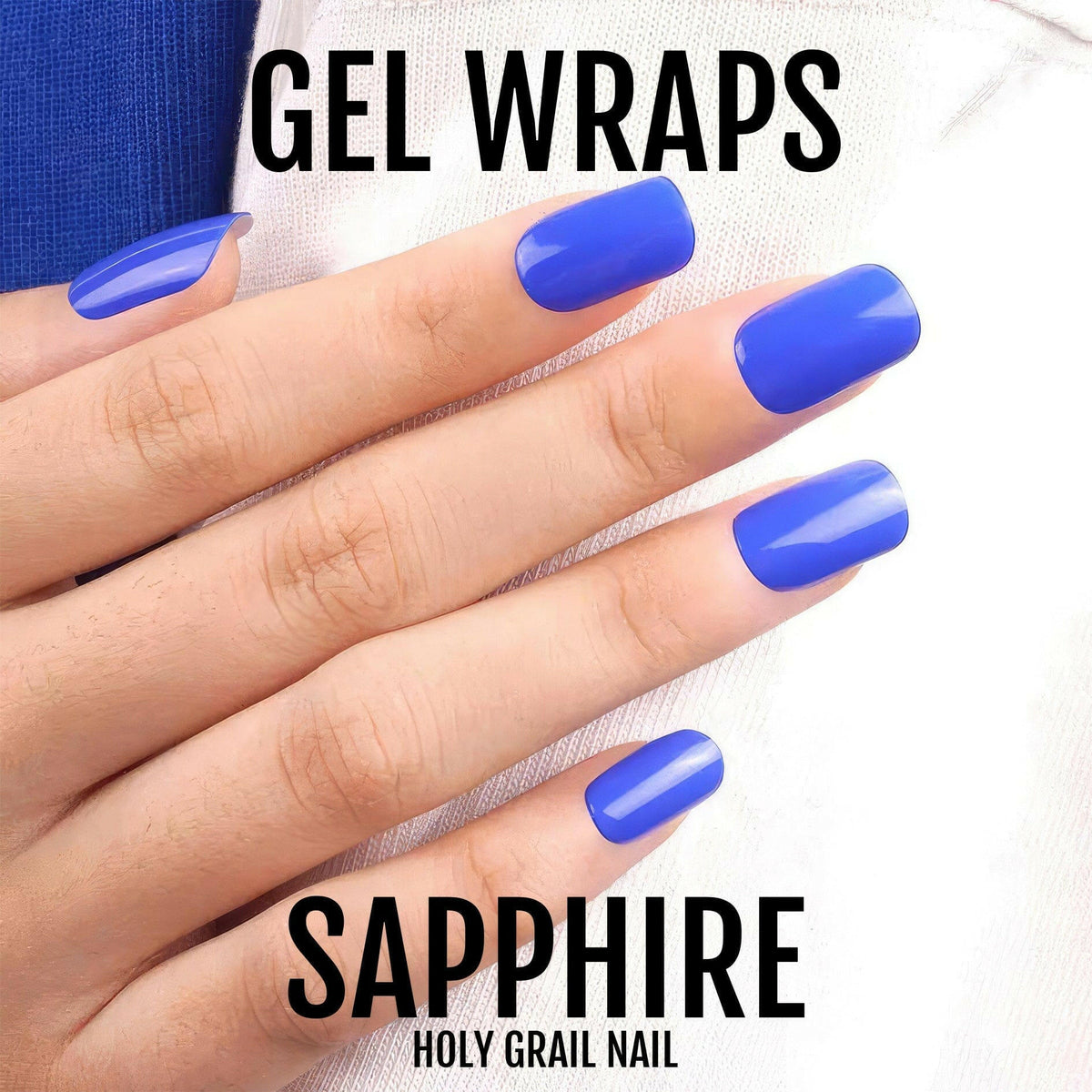 Sapphire blue gel nail wraps on hand displaying bold glossy finish for at-home manicure