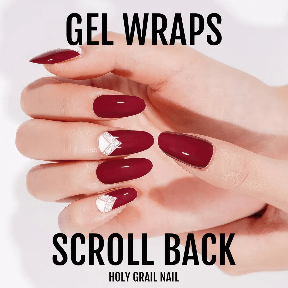 Deep burgundy gel nail wraps with white geometric accents on hand showing elegant manicure