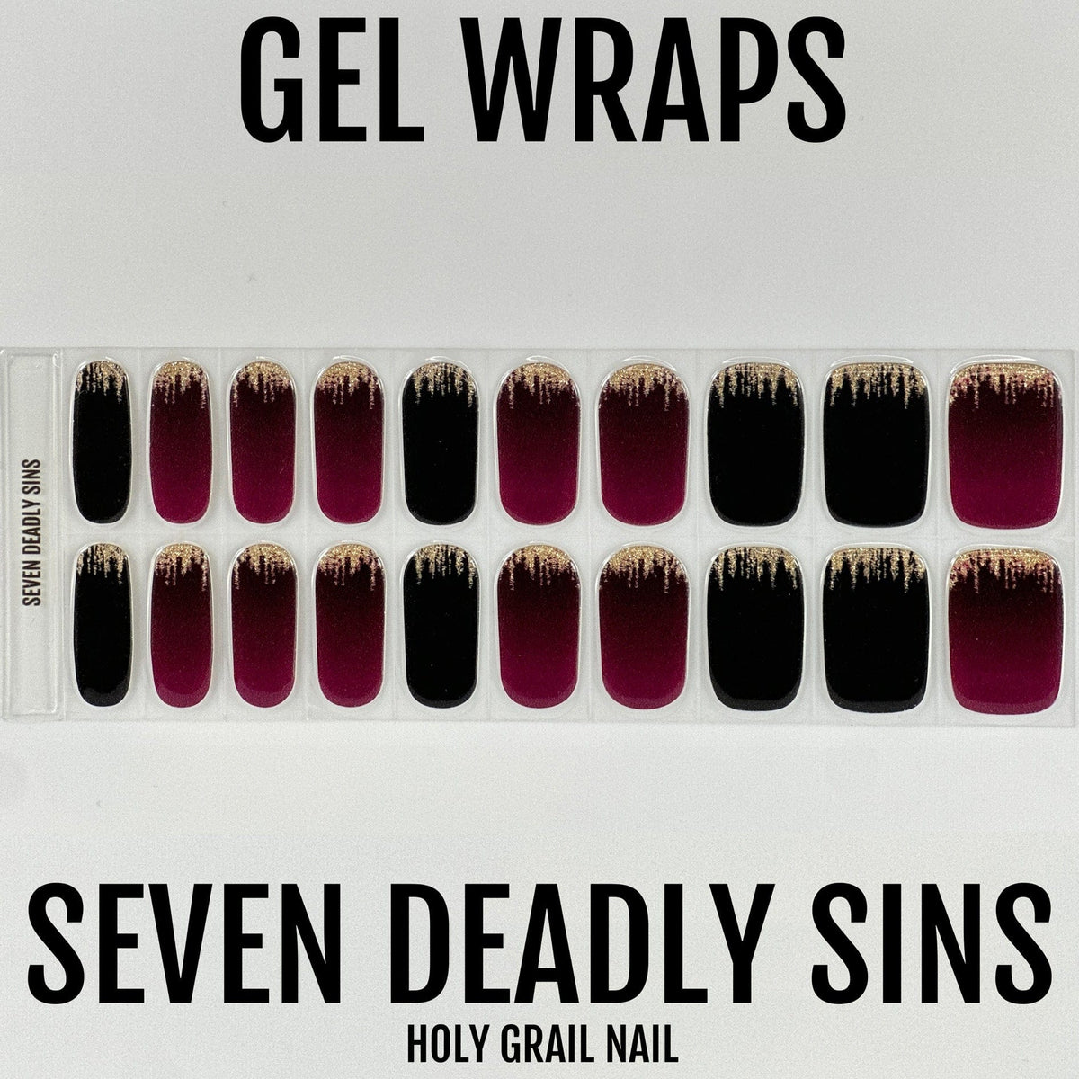 Dark gothic gel nail wraps in burgundy and black with gold glitter accents