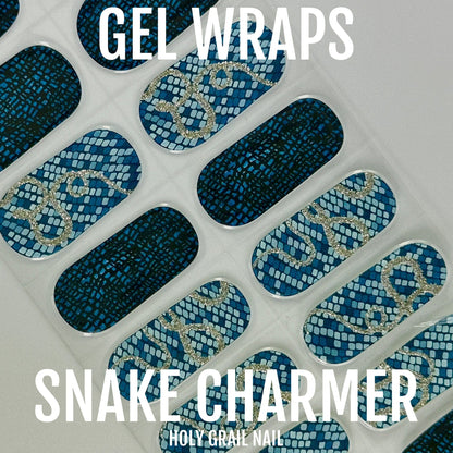 Blue metallic snake print gel nail wraps with silver accents on white background
