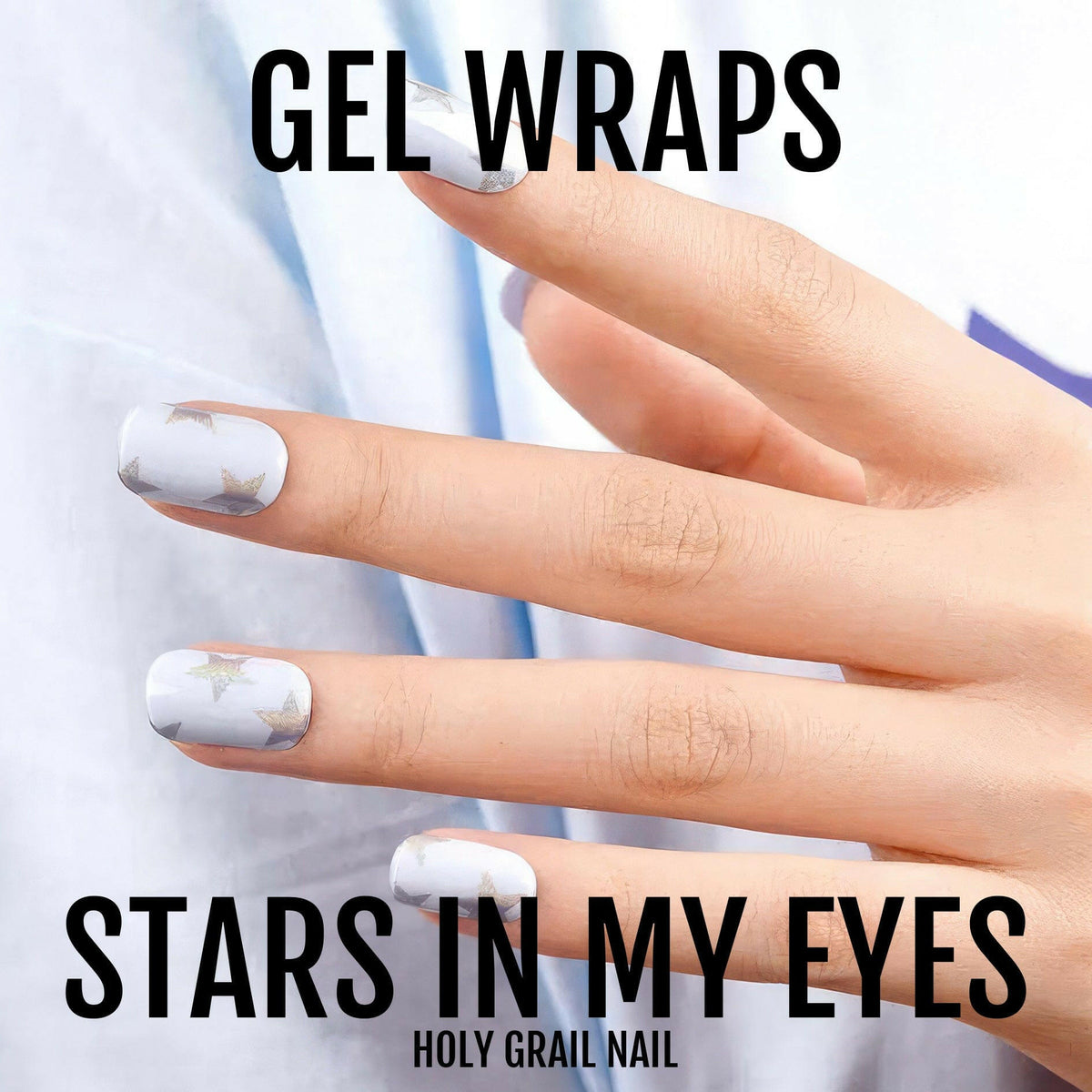 Periwinkle blue gel nail wraps with celestial star pattern on hands