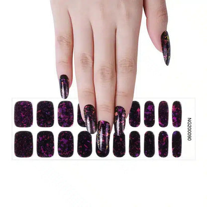 Black holographic glitter gel nail wraps on hand with rainbow sparkle finish