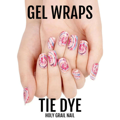 Pink purple tie dye gel nail wraps on hands showing psychedelic swirl nail art