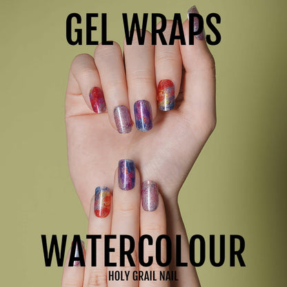 Watercolour gel nail wraps on hands showing multicoloured abstract artistic design