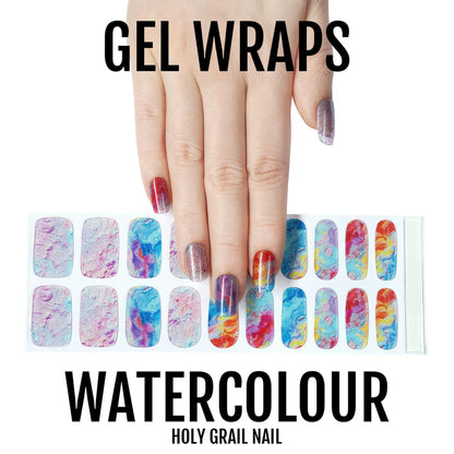 Hand wearing multicoloured watercolour gel nail wraps with full nail wrap sheet