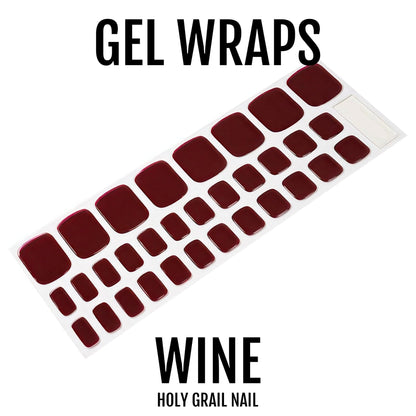 Deep wine gel pedi wraps on backing sheet showing burgundy nail stickers for toes