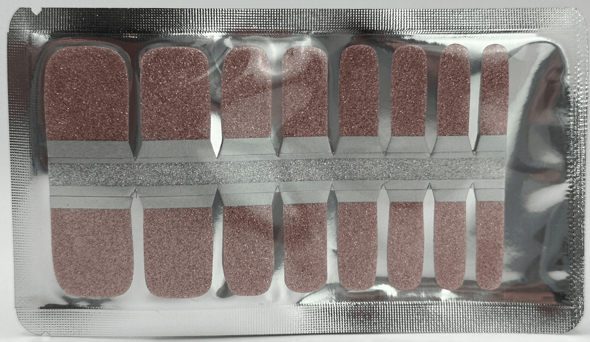 Pink glitter pedicure nail wraps in packaging for at-home foot manicure