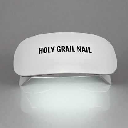 White UV LED nail lamp for curing gel nail wraps and polish at home